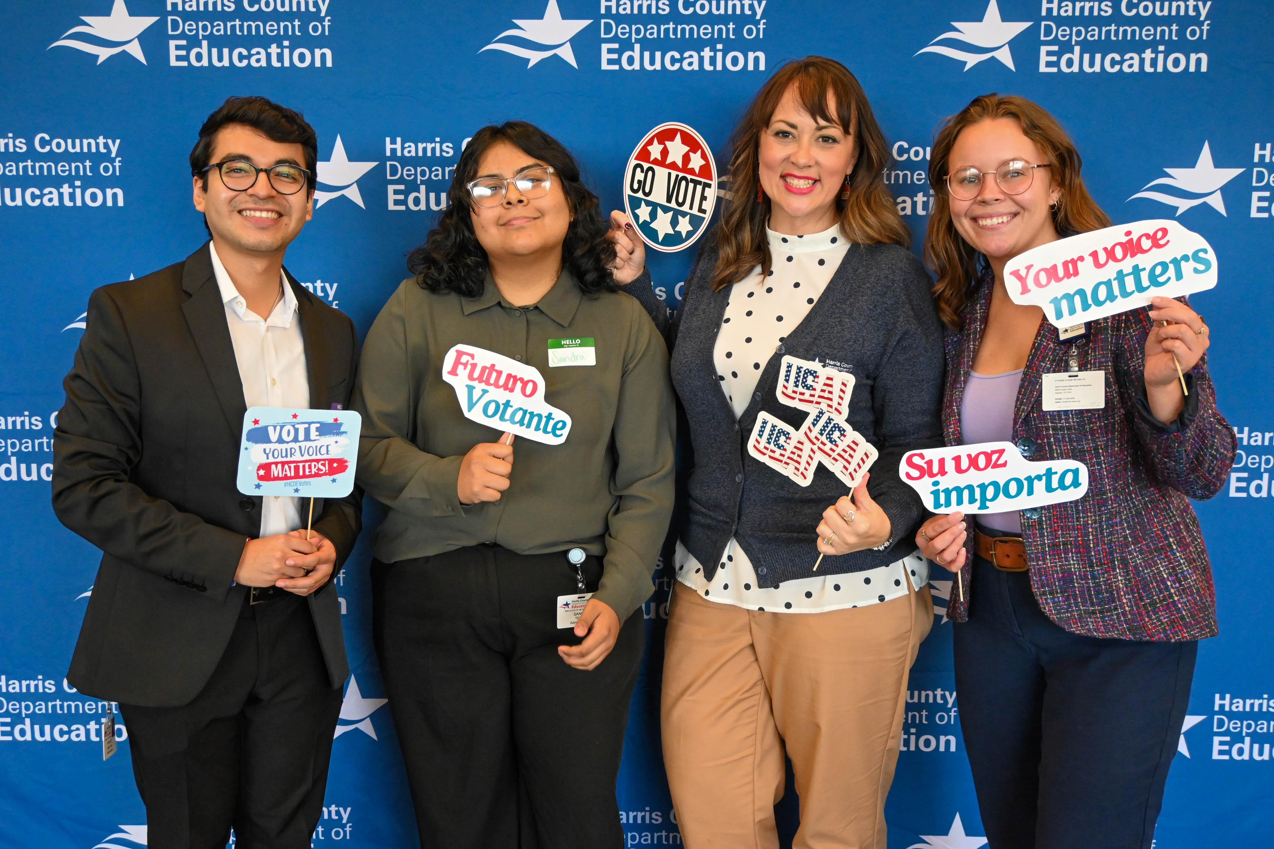 Photo of the civic engagement team with signs promoting voting